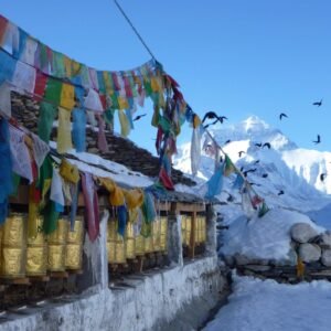 Vibrant prayer flags fluttering against a Himalayan mountain backdrop, capturing the essence of spiritual travel and adventure in Tibet.