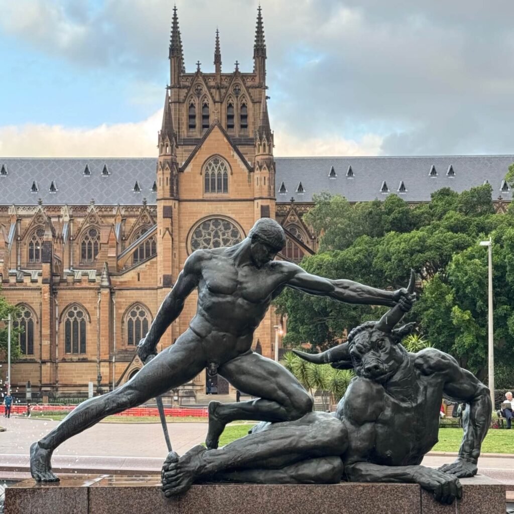 Saint Mary's Cathedral in Sydney with Hyde Park fountain sculpture in foreground.